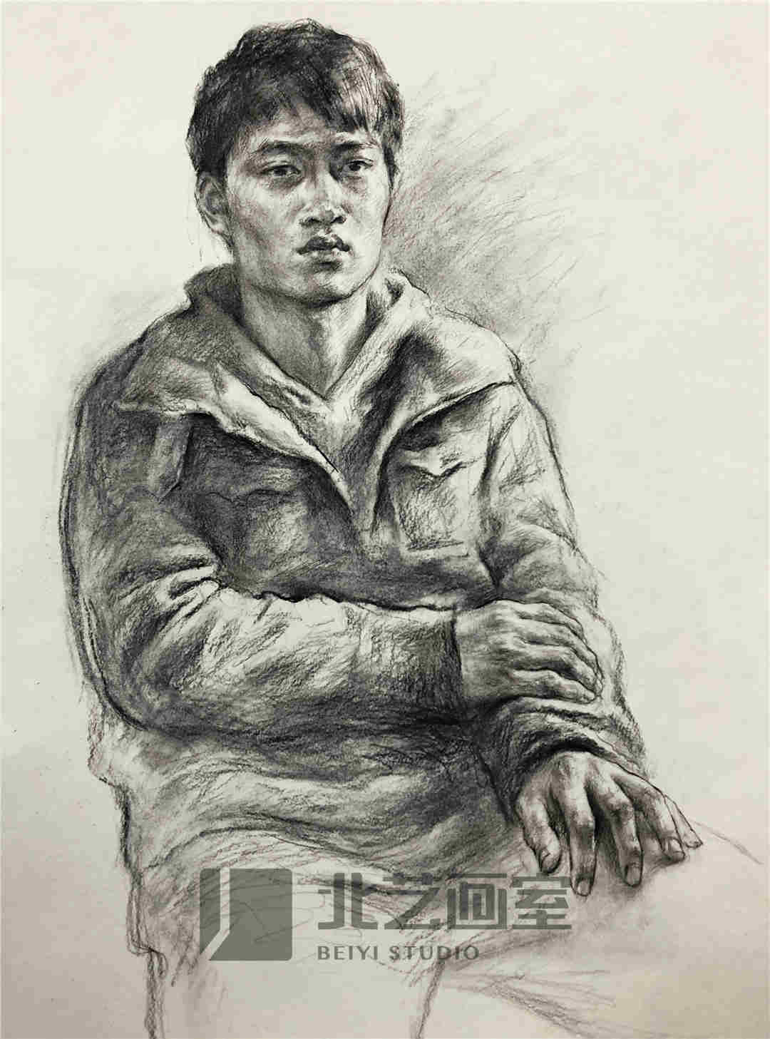 素描半身像作品——正面穿夹克的男青年坐姿